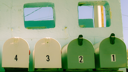 2 cream and 2 green Mailboxes 